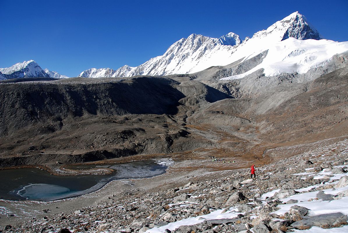 23 Shishapangma Southwest Base Camp With View Of Goldum, Risum, Shishapangma, Pungpa Ri and Nyanang Ri We finally reach Shishapangma Southwest Base Camp (5276m) with the view of Goldum, Risum, Shishapangma, Pungpa Ri and Nyanang Ri. The ABC used by the 1982 British expedition was a friendly place in a little hollow amongst grass and boulders a short distance above the top end of the lake.